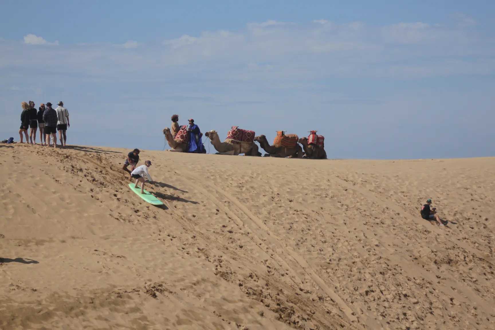 Guest sandboarding on the Timlaline dunes near Tamri
